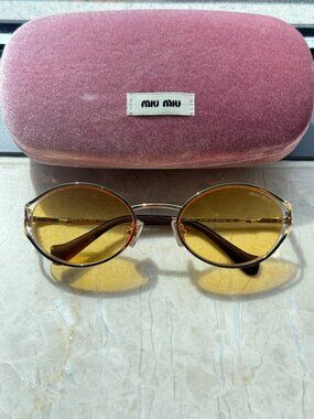 Miu Miu SMU52Y Oval Sunglasses Yellow Lens Gold Frame